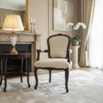 Aarna Armchair : chair with armrest in solid wood with carved detailing and upholstered seat for living room and heritage interiors